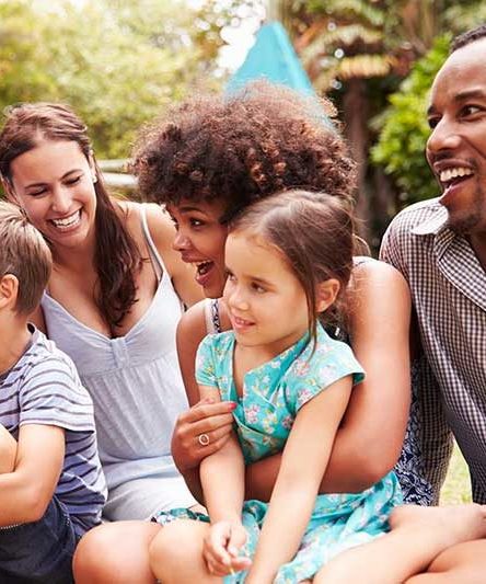 Families sitting outside together 